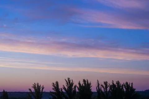Landscape with dramatic light - beautiful golden sunset with saturated sky an Stock Photos