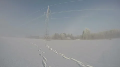 Landscape with electrical pylon and red homestead in fog, time lapse 4K Video stock 59293996
