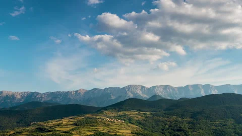 Landscape with fast movement of clouds in the sky, sunlight and shadows. Zoom Stock Footage 293095377