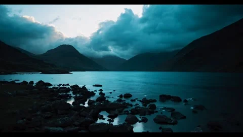 Landscape featuring a tranquil lake surrounded by rugged mountains. Stock Footage 297848769