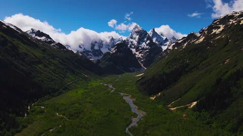 Landscape of Green Valley with River and High Mountains at Background. Aerial Video stock 157681902