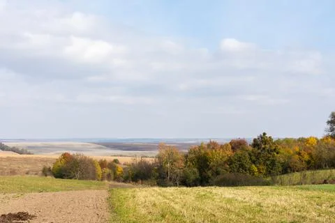 Landscape with harvested fields Stock Photos