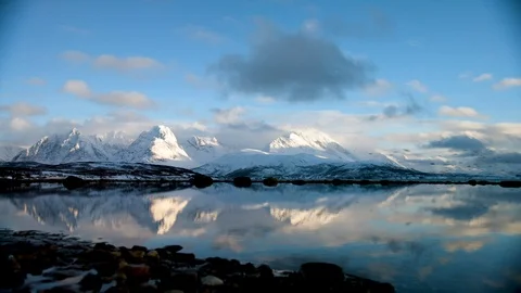 Landscape of high altitude winter mountains and cloudy blue sky Stock Footage 121578044