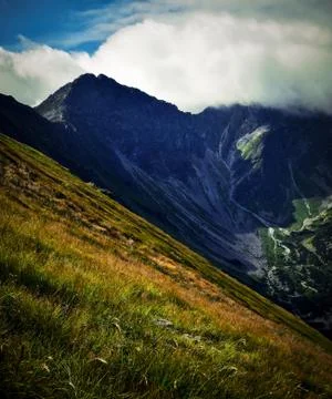 Landscape of high mountain in clouds Stock Photos