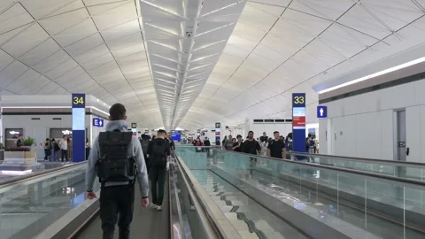Landscape interior view while moving on escalator inside Hong Kong internat.. Видео 331303456
