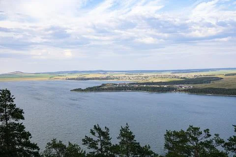 The landscape of the lake, and a distant view of the shore. Stock Photos