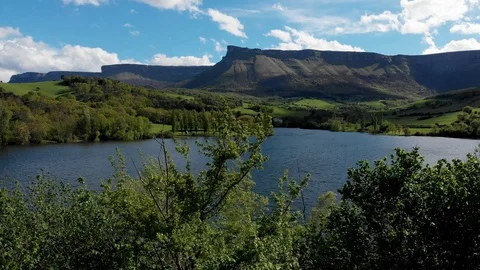 Landscape of lake, green fields and mountain. Stock Footage 106955553