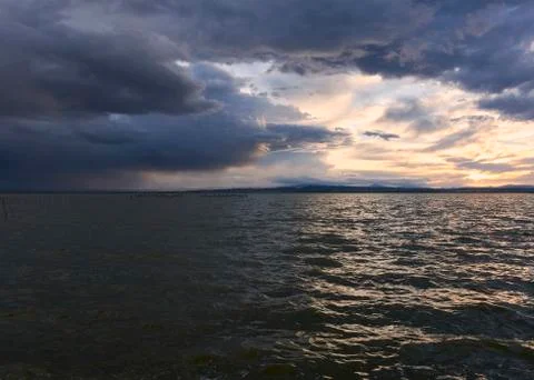 Landscape of a lake with storm clouds Stock Photos