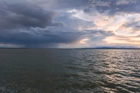 Landscape of a lake with storm clouds Stock Photos