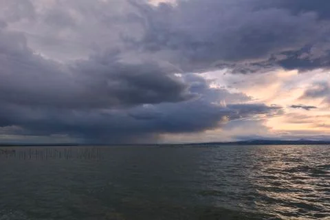 Landscape of a lake with storm clouds Stock Photos