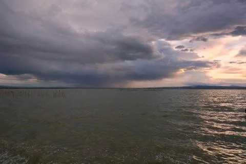 Landscape of a lake with storm clouds Stock Photos