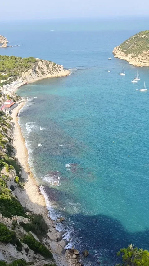 Landscape large cliffs in the coast with transparent water Javea Spain 库存影片 219609543