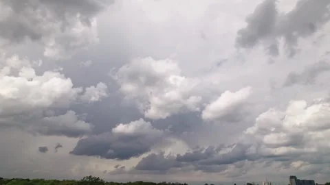 Landscape looking up at storm clouds and steam forming on sunny skyline 스톡 동영상 308195100