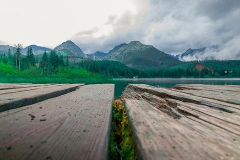 Landscape from low angle of cloudy and misty mountains named High Tatras or Vyso Stock Photos