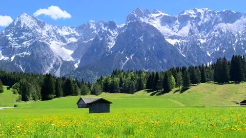 Landscape with meadows and the Karwendel Mountains near Mittenwald Stock Footage 337784892