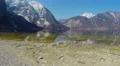 Landscape for meditation, mountains with glacier on peaks, stony bottom of lake 4k or 4k+ Resolution