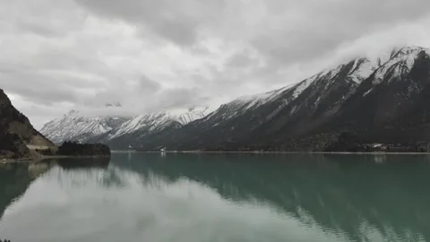 Landscape  Mirror Reflection of Snow Mountains on Ranwu Lake Tibet Stock Footage 332525284