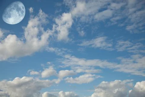 Landscape with the moon in the daytime sky Stock Photos