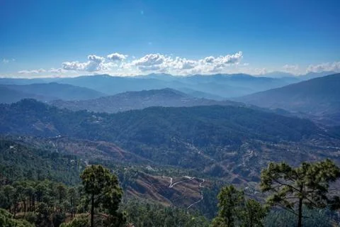 Landscape of a mountain range clicked from a height, layers of mountains. Stock Photos
