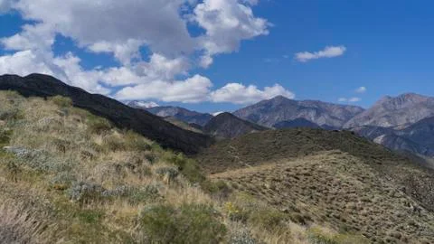 Landscape of mountain range from hillside Stock Photos