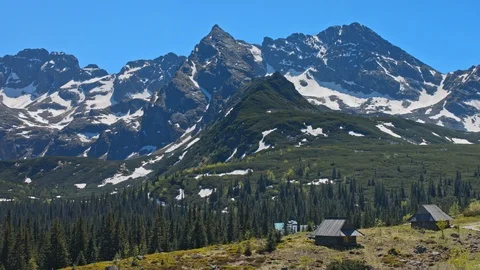 Landscape of mountain range peaks with snow and village Stock Footage 121742351