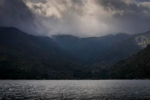 Landscape of mountain range under cloudy sky Stock Photos