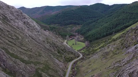 Landscape with mountain road between forests and rocks Stock Footage 261996291