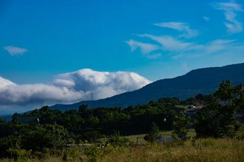 Landscape of a mountain valley with clouds in the Crimean mountains above Gur Stock Photos