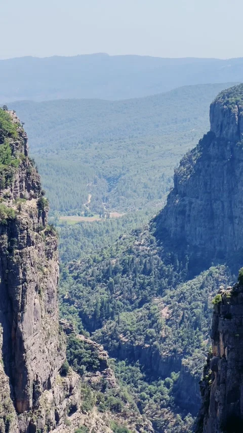 The landscape of a mountain valley with forests and cliffs.  Stock Footage 283295197