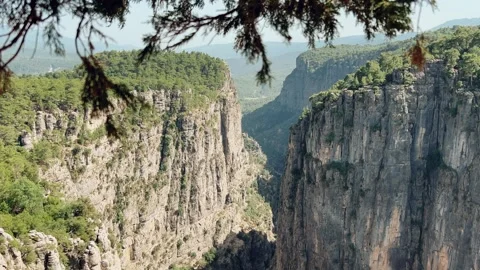 The landscape of a mountain valley with forests and cliffs.  Stock Footage 283295688
