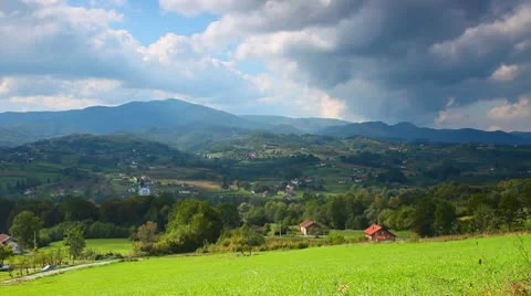 Landscape Mountains hills meadow and blue cloudy sky Stock Footage 10761453