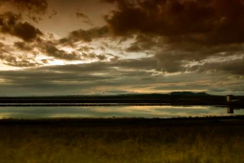 Landscape of multicolored clouds at sunset. Stock Photos