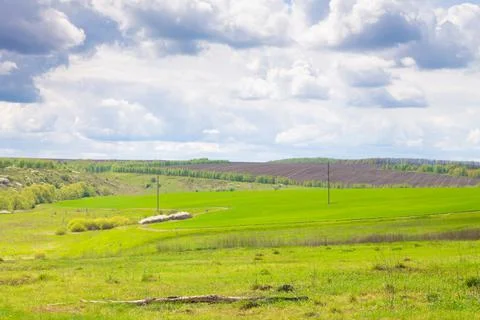 Landscape of nature Forests and fields against the background of a cloudy rai Stock Photos