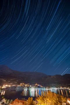 Landscape of a night town on beachfront Stock Photos