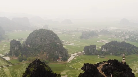 Landscape of Ninh Binh province fields close to Hang Mua Peak on foggy day Stock Footage 147351165