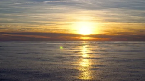 Landscape orange sunset with sun reflected in the water Stock Footage 106664216