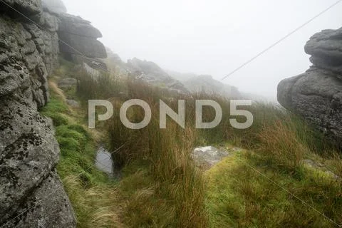 Landscape over dartmoor national park in autumn with rocks and foliage Stock Photos