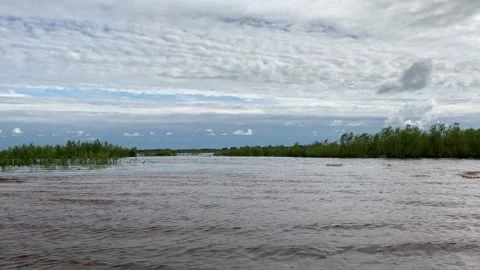A landscape overlooking the river, a sky with clouds and a skyline with a Video stock 134853011