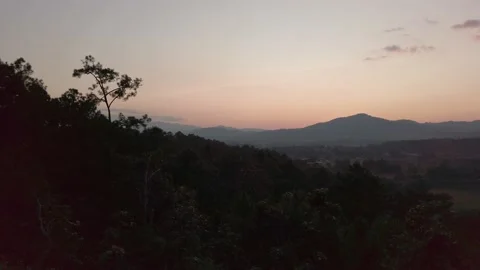 Landscape panorama sunset view of mountain range with some cloud while sund.. Stock Footage 238965712