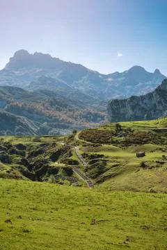 Landscape with path between mountains Stock Photos