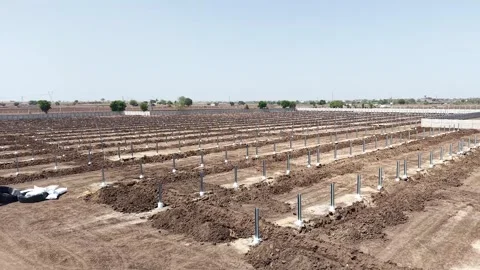 Landscape perspective showcasing an expansive array of steel ground-mounting Stock-Footage 337115715