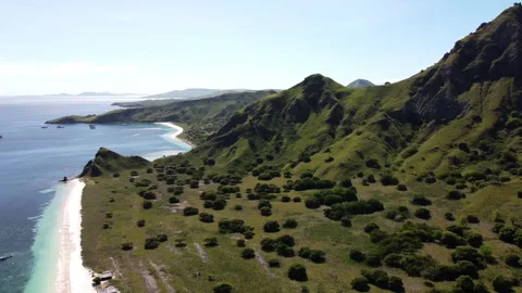 Landscape of a pink beach, rotating drone view pan camera movement Stock Footage 276159572