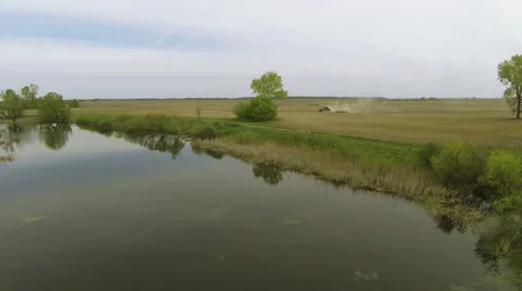 Landscape with  plowing tractor and  river. Aerial  nature  view Stock Footage 40164412