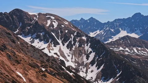 Landscape of Polish mountain range Tatry with peaks covered with snow Stock Footage 121370396