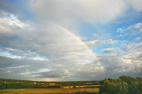 Landscape with rainbow Stock Photos
