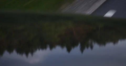A landscape is reflected in the engine hood of a driving car Vidéo 263036878