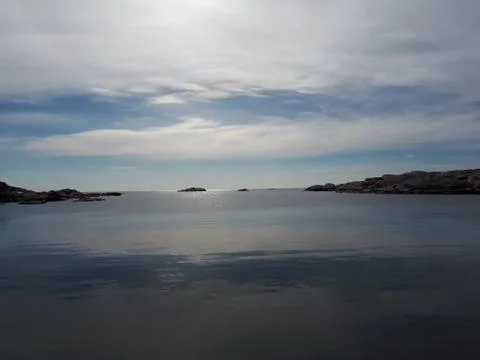 Landscape with the reflection of the sky in water Stock Photos