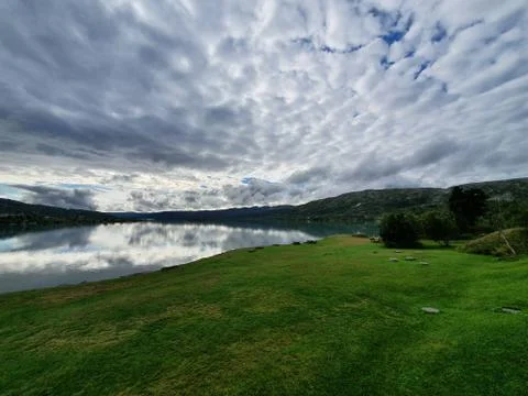 Landscape with the reflection of the sky in the water Stock Photos