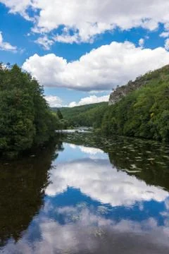 Landscape with reflection of water, clouds, forest, trees Stock-Fotos