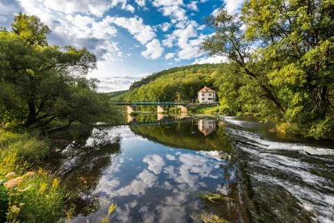 Landscape with reflection of water, clouds, forest, trees Stock-Fotos